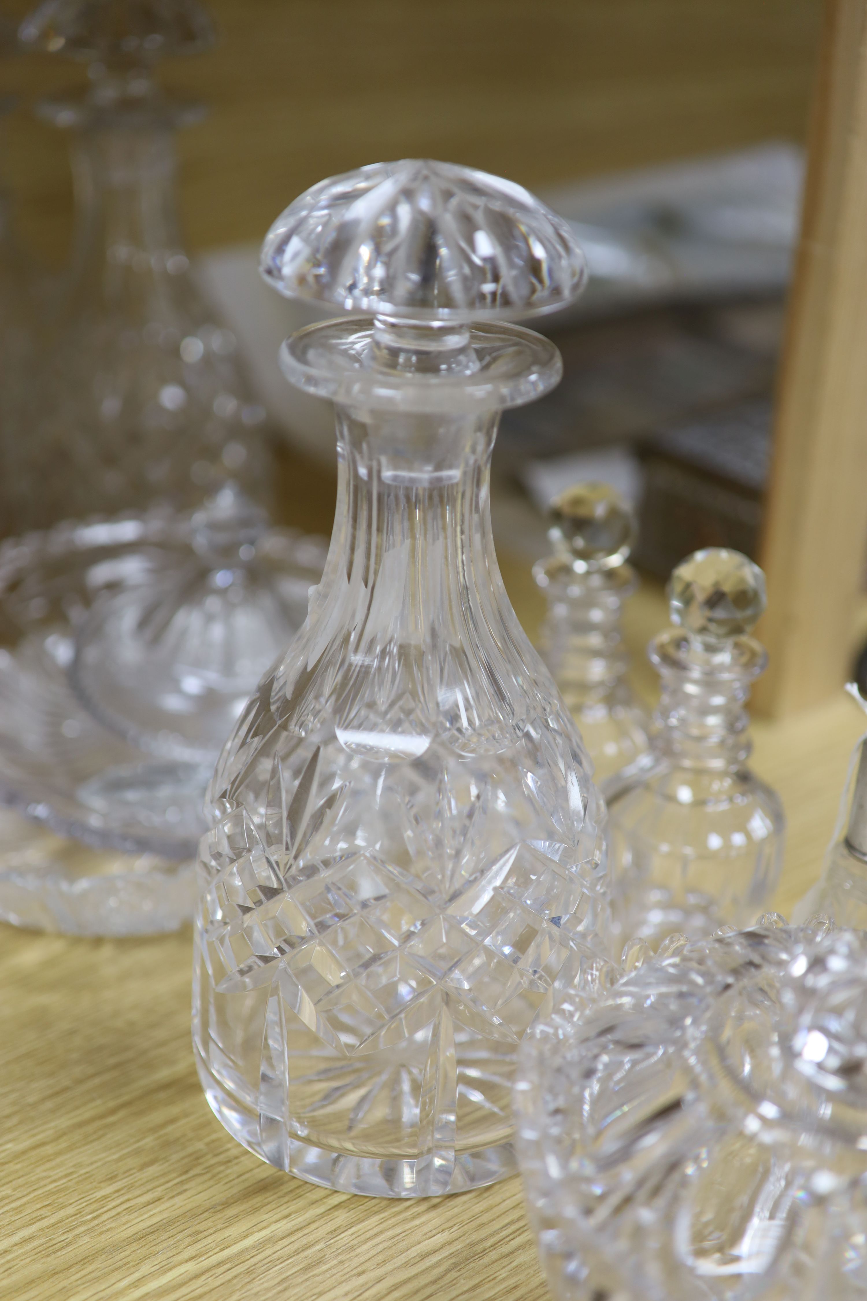 A pair of cut glass decanters, two others and mixed cut glass